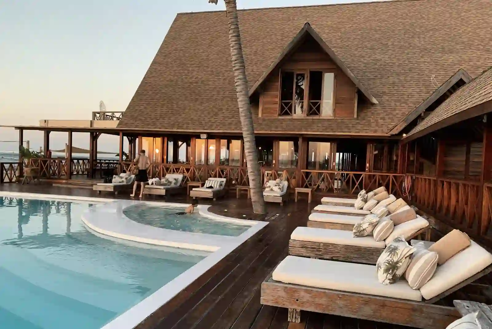 Wooden beach lodge with pool and loungers in Tulum style