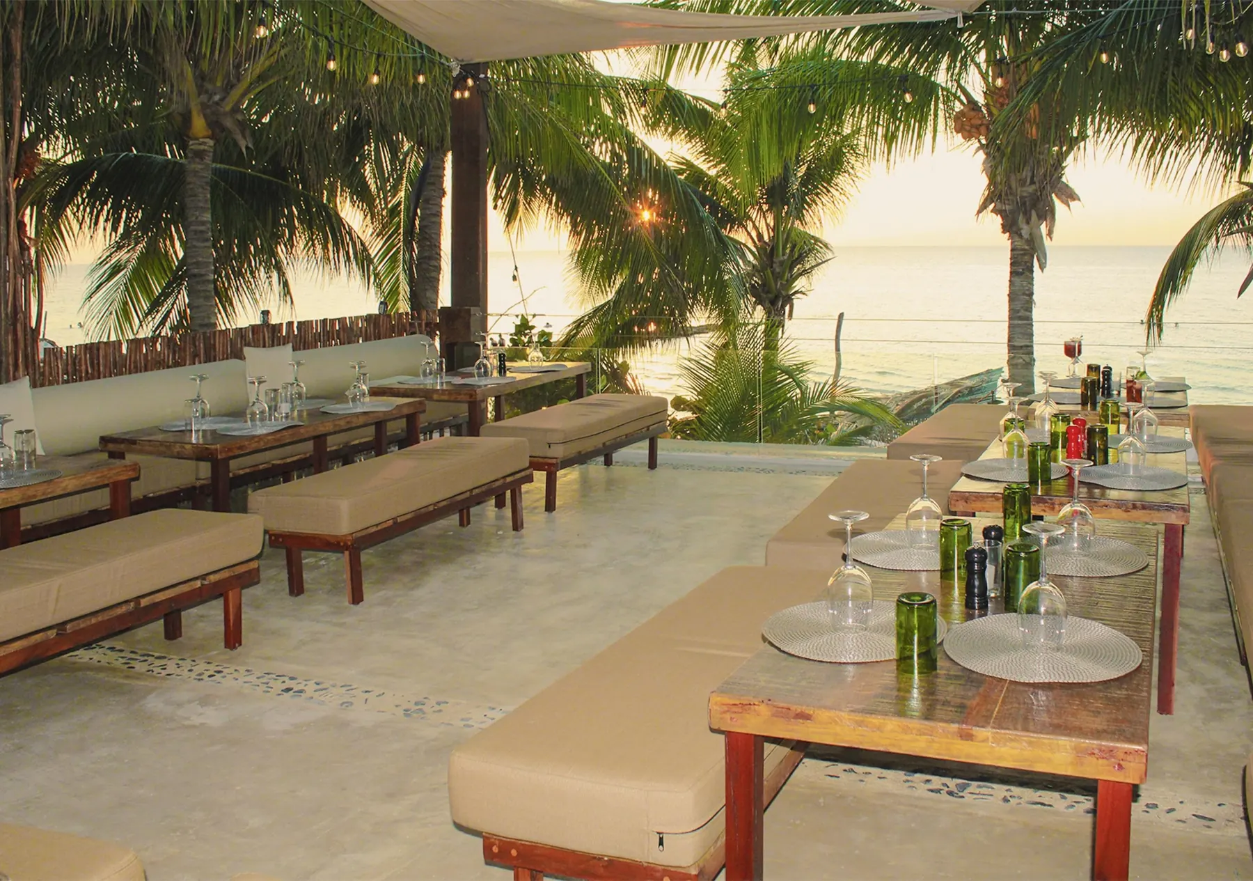 A shaded beach lounge facing the Caribbean Sea
