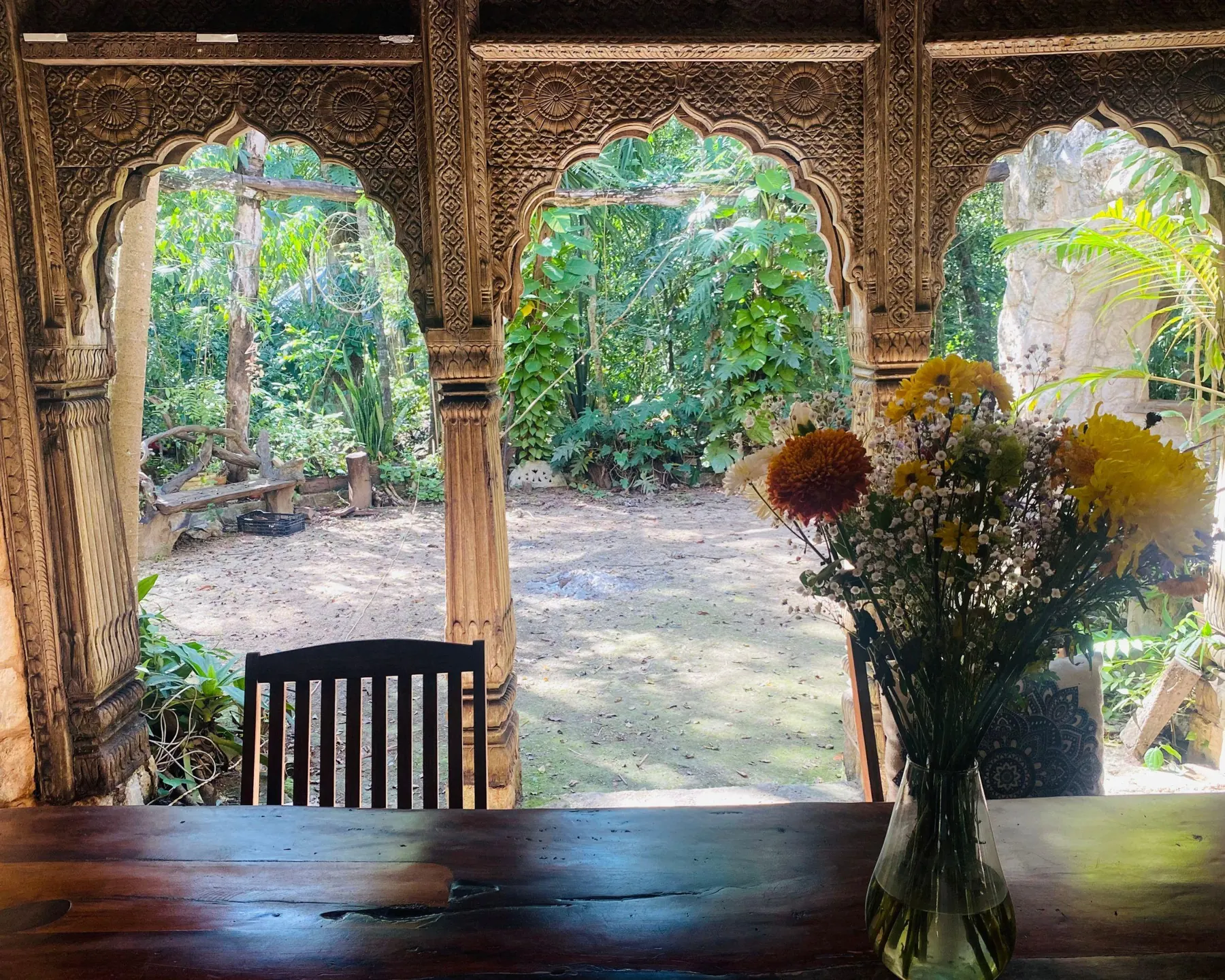 Carved arches opening onto the jungle garden
