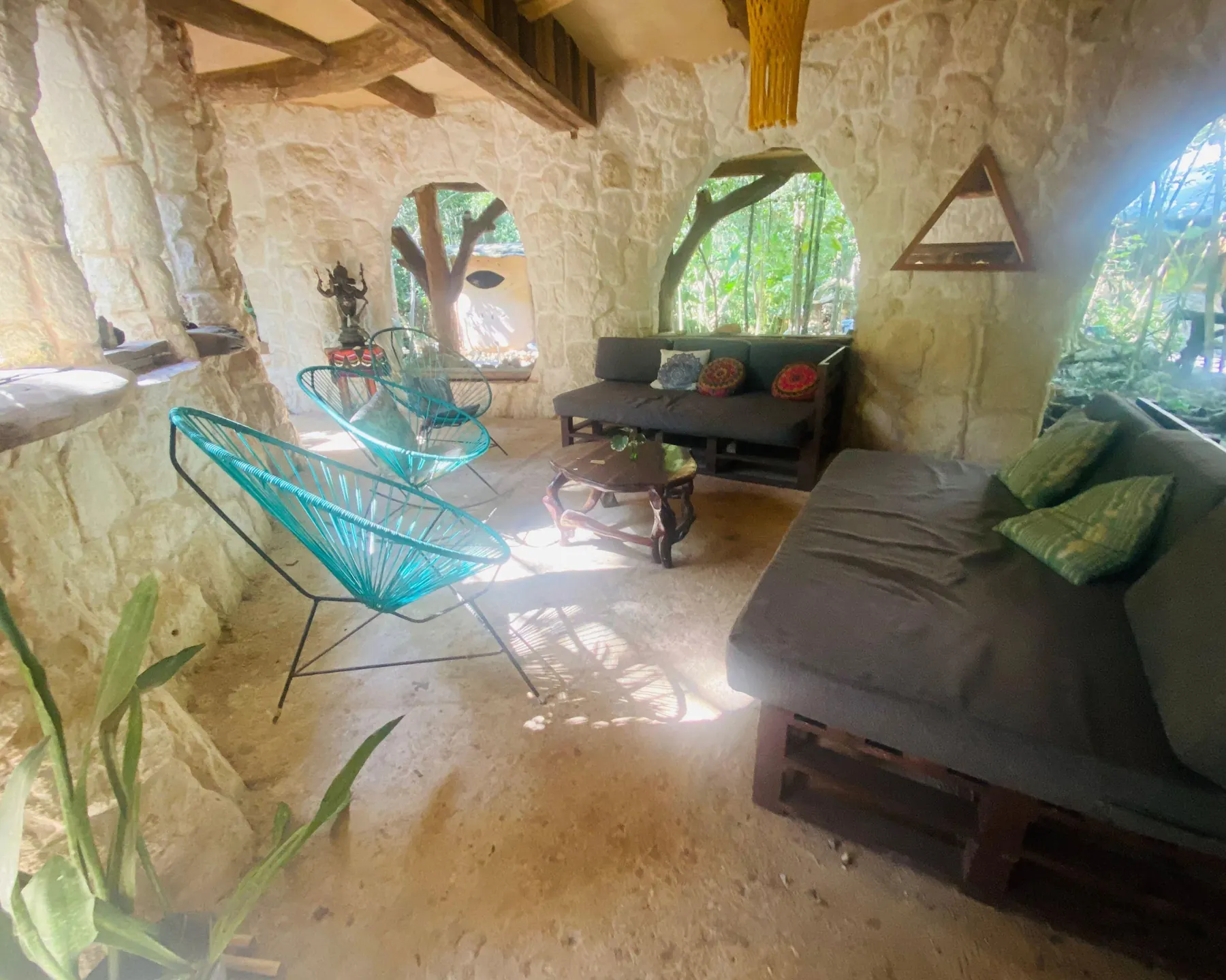 A cool, cave-like lounge with hammock chairs